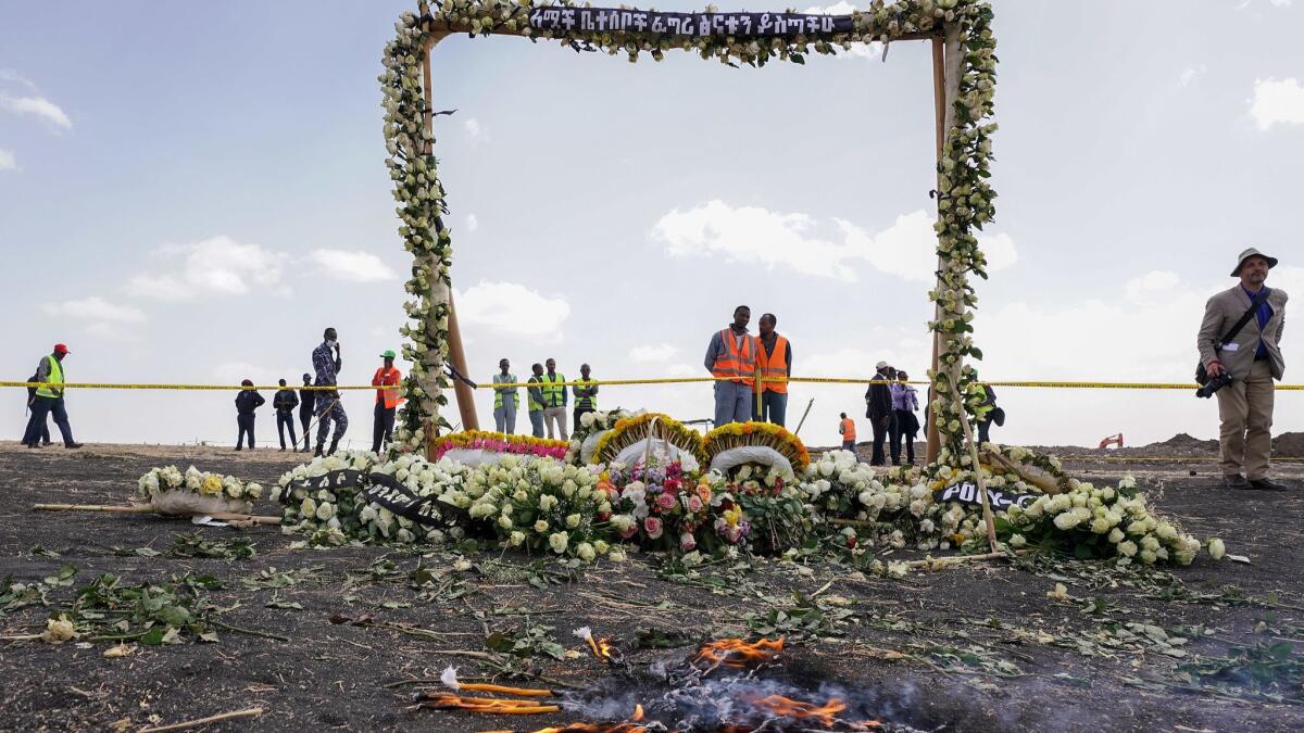 A flower-adorned memorial arch erected at the site of the Ethiopian Airlines crash on March 14 in Ejere, Ethiopia.