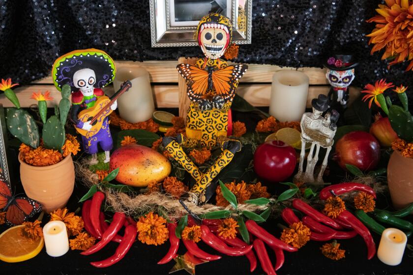 Photographs by Michael Owen Baker??For The Times A DAY OF THE DEAD altar at Self Help Graphics & Art in Boyle Heights. Other altars will be adorned throughout L.A. County.