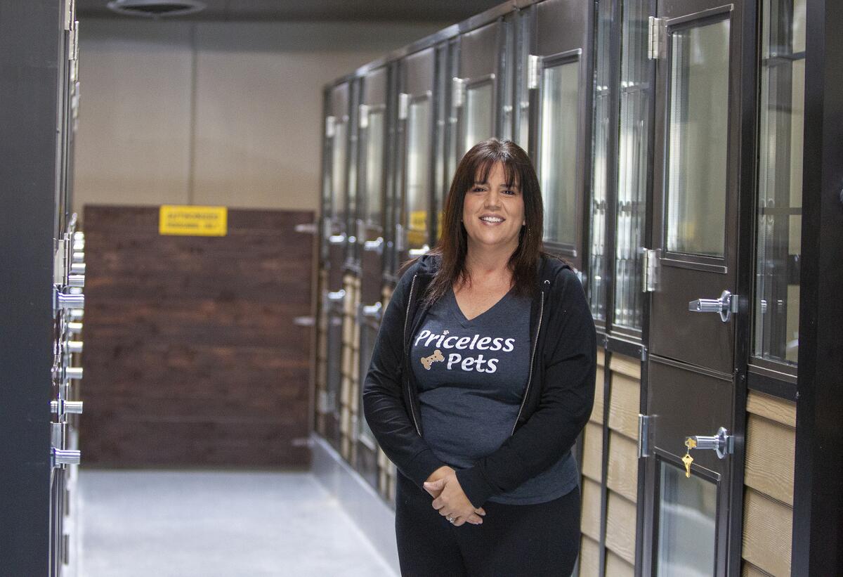Lisa Price, chief executive and co-founder of Priceless Pets poses in a pet adoption center in Costa Mesa.