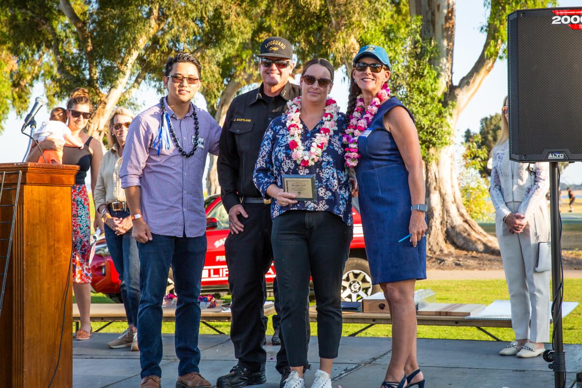 Elvin Lai, co-emcee, Lifeguard Chief James Gartland, PAESAN honoree Lifeguard Alison Knight and co-emcee Marcella Bothwell.