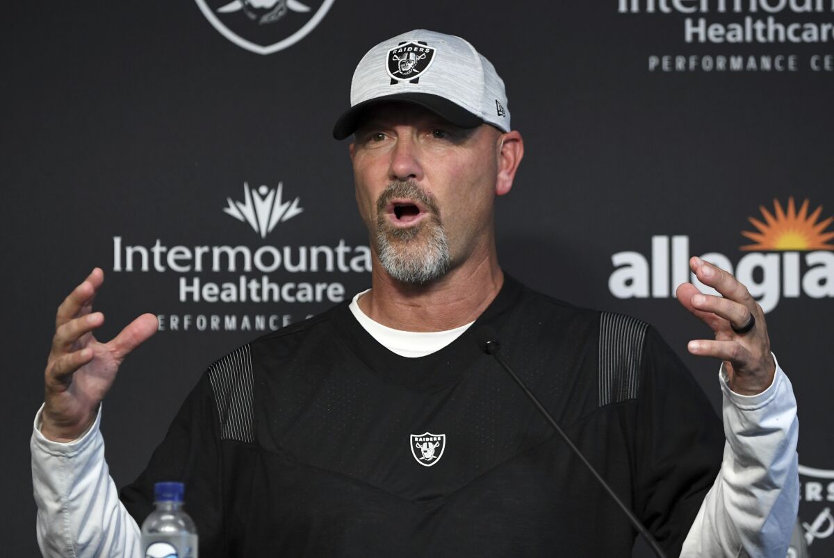 FILE - Las Vegas Raiders defensive coordinator Gus Bradley speaks to the media after an NFL football practice in Henderson, Nev., Friday, July 30, 2021. The Indianapolis Colts hired Gus Bradley as their new defensive coordinator Monday, Feb. 7, 2022. (AP Photo/David Becker, File)