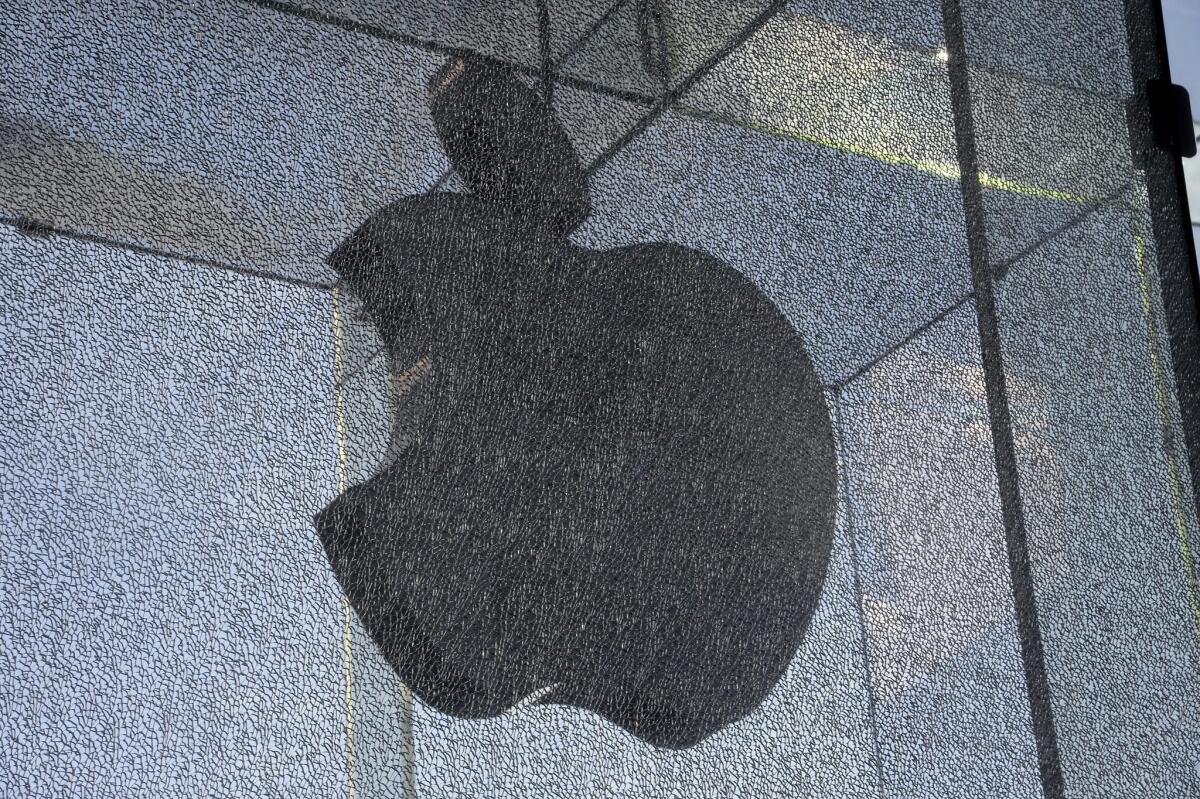A glass panel at the Apple store on 5th Avenue is Manhattan was cracked in an encounter with a snow blower.