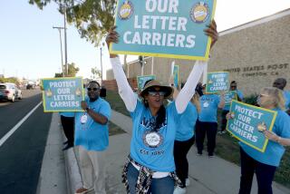 Compton, CA U.S. Postal Service letter carriers rally at the USPS Compton Main Office on Wednesday, Oct. 4, 2023, to call attention robberies and physical assaults experienced by letter carriers locally and across the nation. Postal workers said crimes against them are more frequent, brazen and violent. (Luis Sinco / Los Angeles Times)