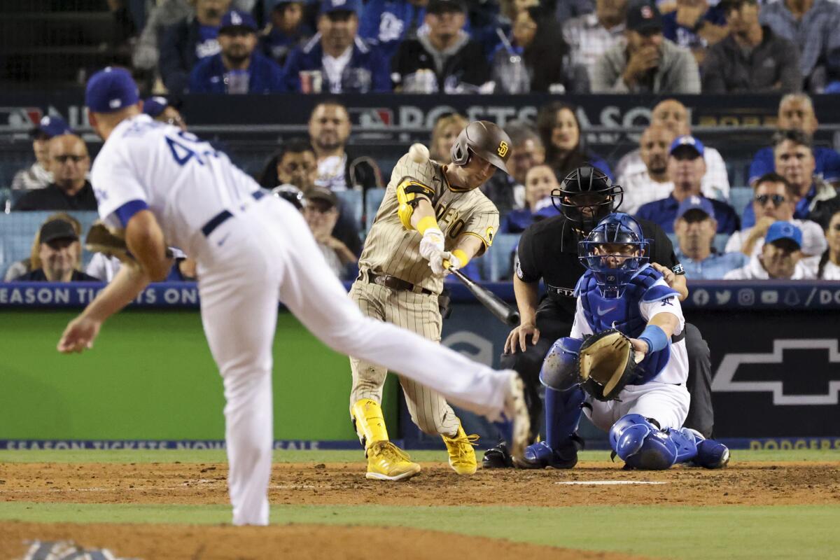 San Diego's Jake Cronenworth hits a solo home run off Dodgers relief pitcher Blake Treinen during the eighth inning.