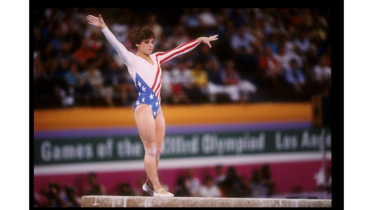 Mary Lou Retton in action on the balance beam during the 1984 Summer Olympics in Los Angeles.
