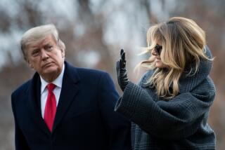 US President Donald Trump and First Lady Melania Trump walk from Marine One as they return to the White House on December 31, 2020, in Washington, DC. (Photo by Brendan Smialowski / AFP) (Photo by BRENDAN SMIALOWSKI/AFP via Getty Images)