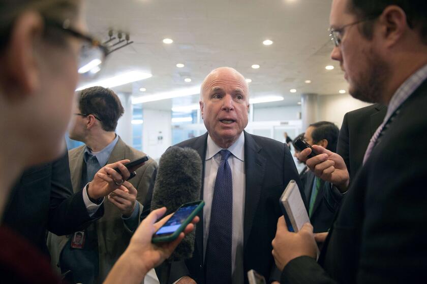 Sen. John McCain speaks to reporters about the release of a report on CIA interrogations Tuesday.