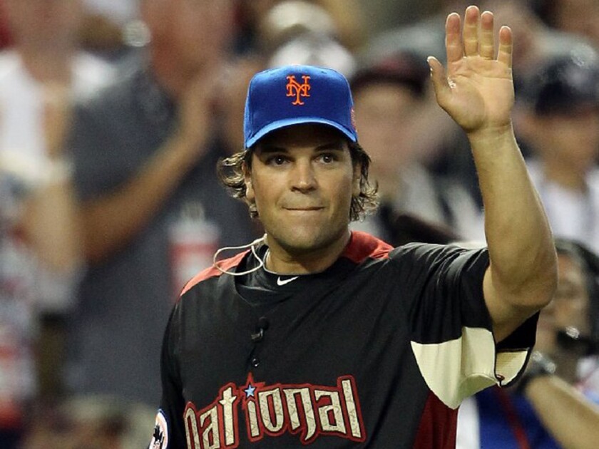 Former MLB catcher Mike Piazza waves during the 2011 All-Star Legends & Celebrity Softball Game at Chase Field in Phoenix on July 10, 2011.