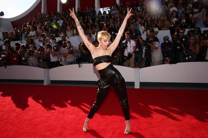 Miley Cyrus blames her time on "Hannah Montana" for long-lasting body image issues.