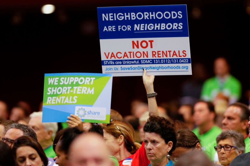 Neighborhood residents show their support and opposition to regulating short-term vacation rentals at a special City Council meeting.