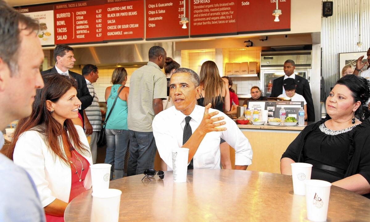 President Obama joins several working parents for lunch at a Chipotle restaurant prior to speaking at the White House Summit on Working Families.