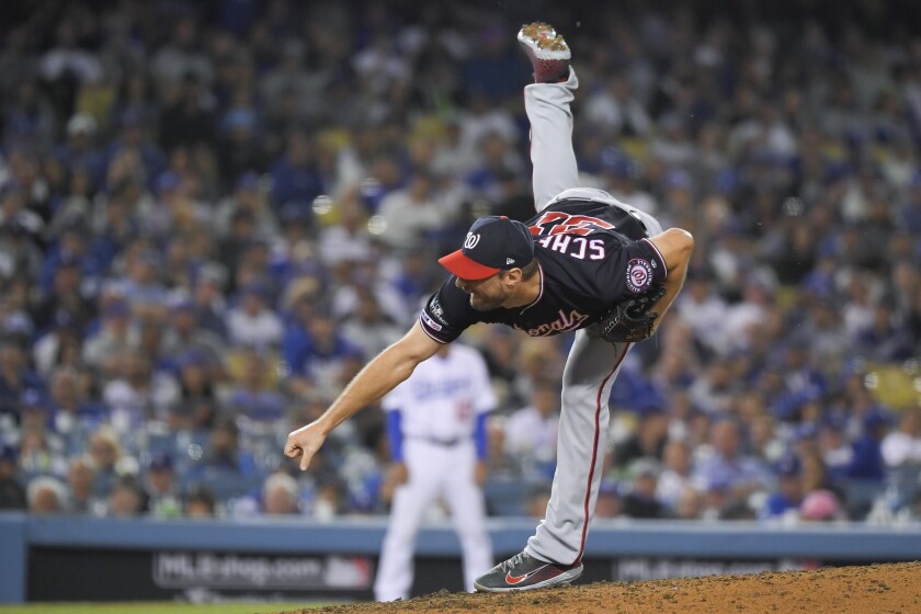 Max Scherzer pitches during the eighth inning of Game 2 on Oct. 4.