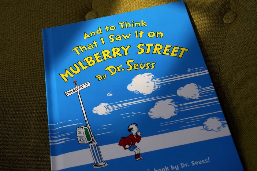 A copy of the book "And to Think That I Saw It on Mulberry Street" by Dr. Seuss