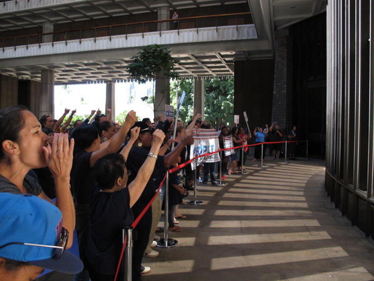 Proponents and opponents of gay marriage rally in the state Capitol in Honolulu on Wednesday.