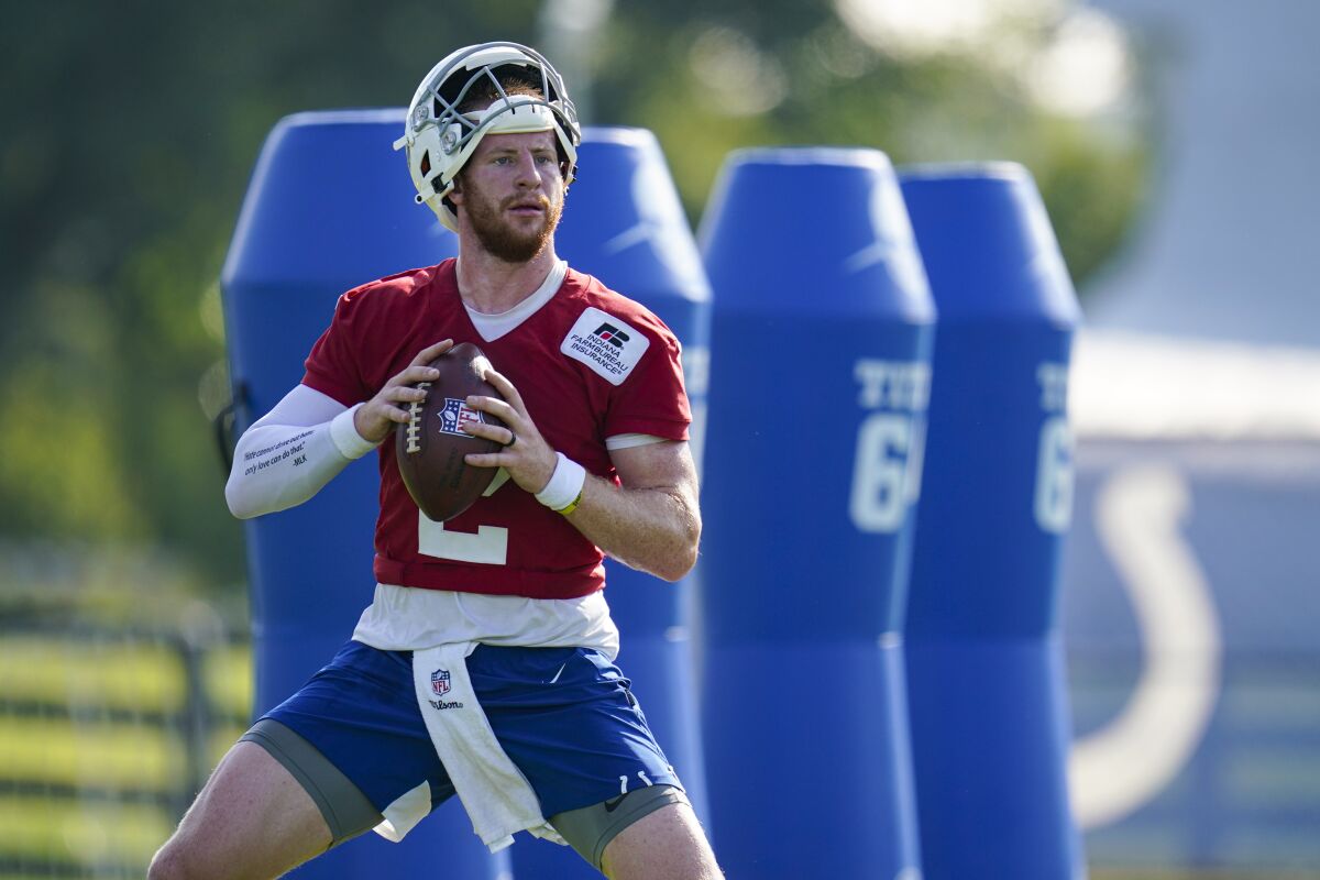 Indianapolis Colts quarterback Carson Wentz (2) throws during practice at the NFL team's football training camp in Westfield, Ind., Monday, Aug. 23, 2021. (AP Photo/Michael Conroy)