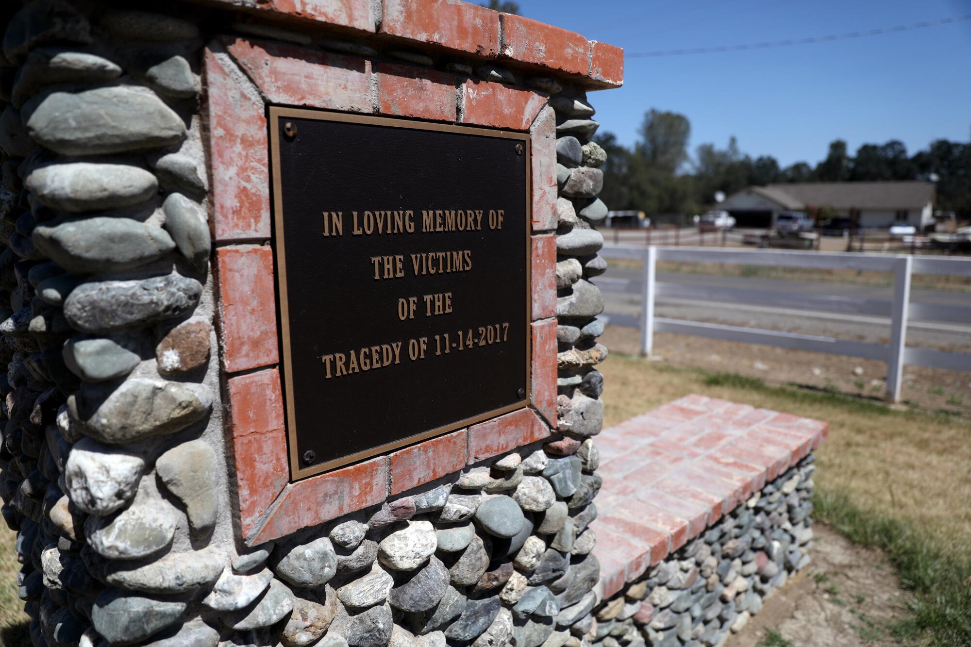 A plaque next to a fence.