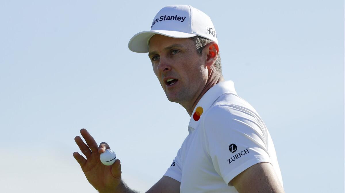 Justin Rose of England reacts as he walks off the 17th hole of the South Course at Torrey Pines Golf Course during the third round of the Farmers Insurance Open.
