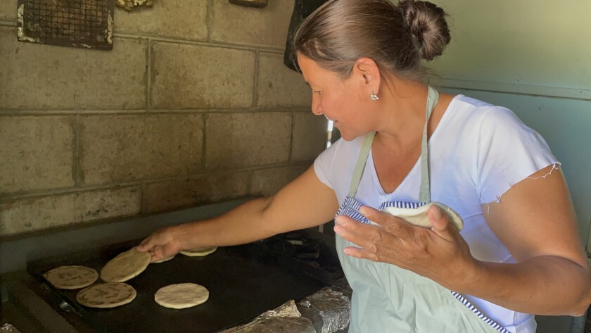 Corn tortillas are prepared every day by María Gloria Reyes for her entire family in Cabañas, El Salvador.