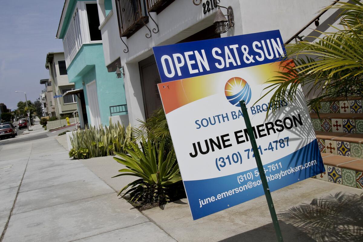 An open house in Manhattan Beach. Sales of previously owned homes across the U.S. slipped slightly in March.