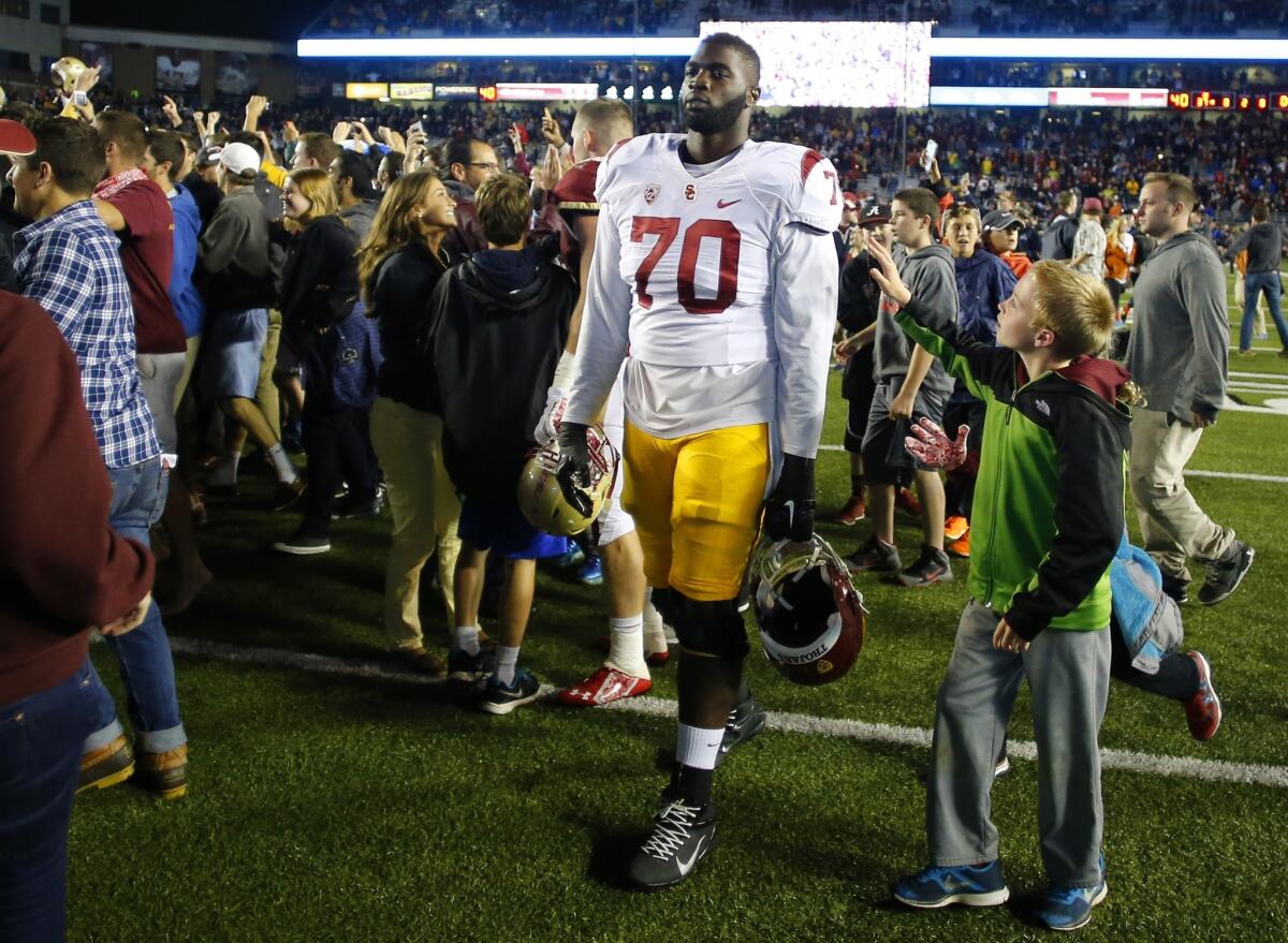 USC offensive lineman Aundrey Walker, who hasn't played this season, leaves the field after the Trojans' 37-31 loss to Boston College on Sept. 13.