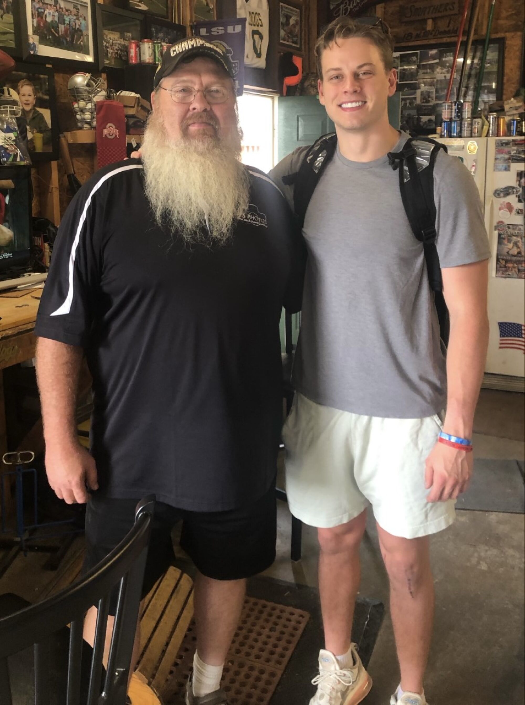 Sam Smathers, left, poses for a photo with Joe Burrow in 2021