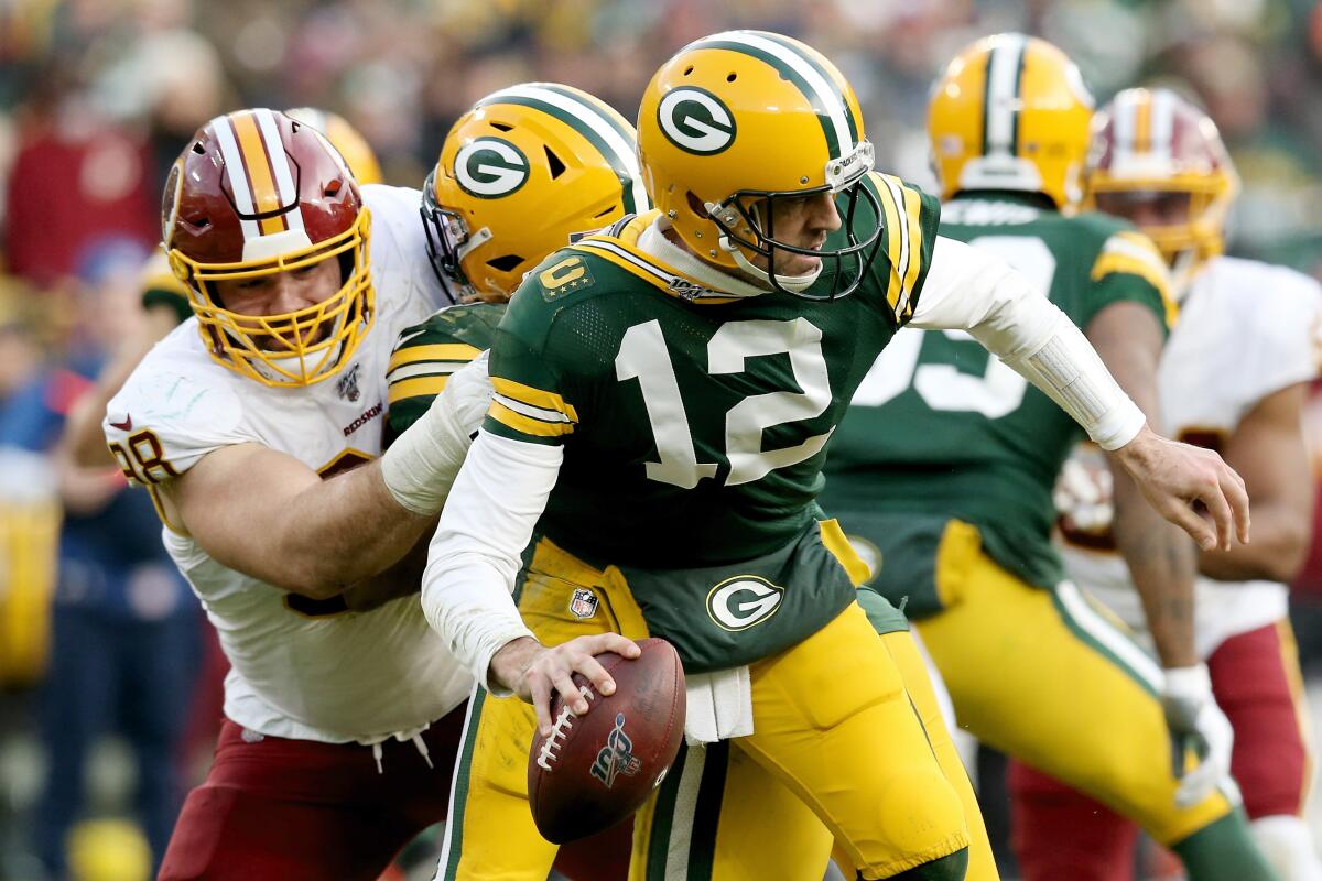 Washington Redskins defensive end Matthew Ioannidis sacks Green Bay Packers quarterback Aaron Rodgers.