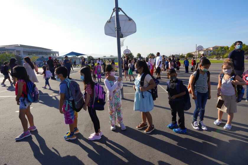 Students lined up for school on July 21, 2021 at Enrique S. Camarena Elementary School in Chula Vista. 