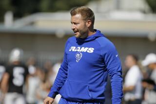 Rams head coach Sean McVay watches players stretch during a joint practice with the Raiders in 2019.