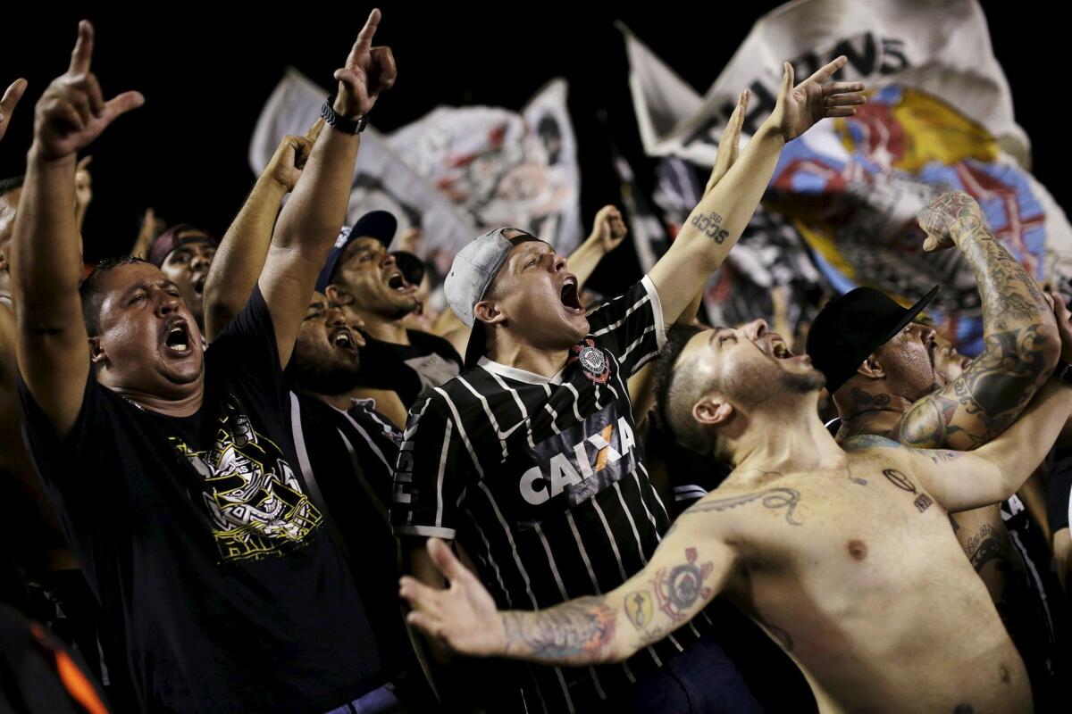 Fans celebrate as Corinthians win the Brazil Serie A soccer championship title, following their match with Vasco, in Rio de Janeiro, November 19, 2015. Corinthians were crowned Brazilian champions on Thursday after a 1-1 draw with Vasco da Gama, coupled with Atletico Mineiro's 4-2 defeat at Sao Paulo, game them an unassailable 12-point lead with three games remaining. REUTERS/Ueslei Marcelino ** Usable by SD ONLY **