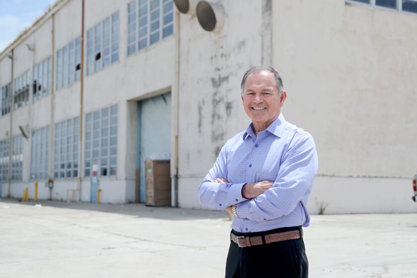 Retired Marine Corps Brig. Gen. Michael Aguilar, executive director of the Flying Leathernecks Historical Foundation, poses for a portrait in front of a historic WWII hangar at the Orange County Great Park in Irvine.