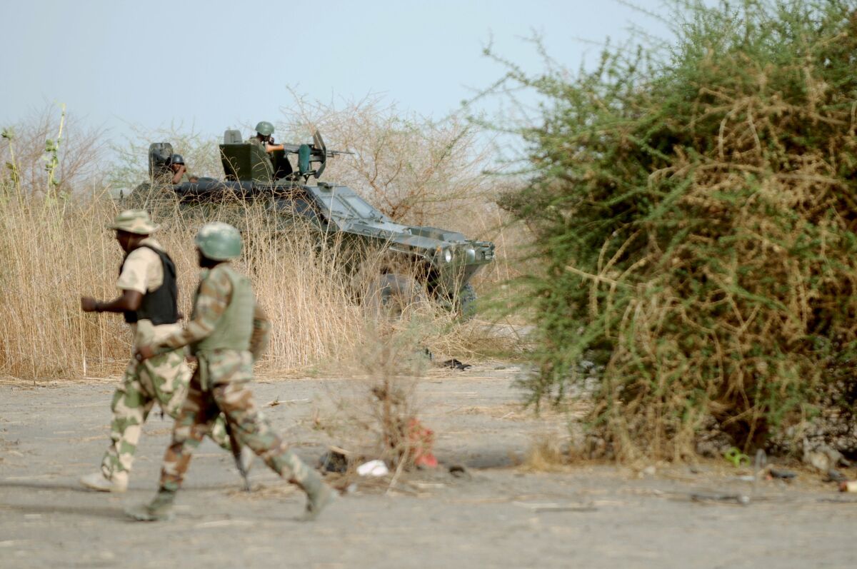 Nigerian soldiers patrol in the north of Borno state on June 5, 2013.