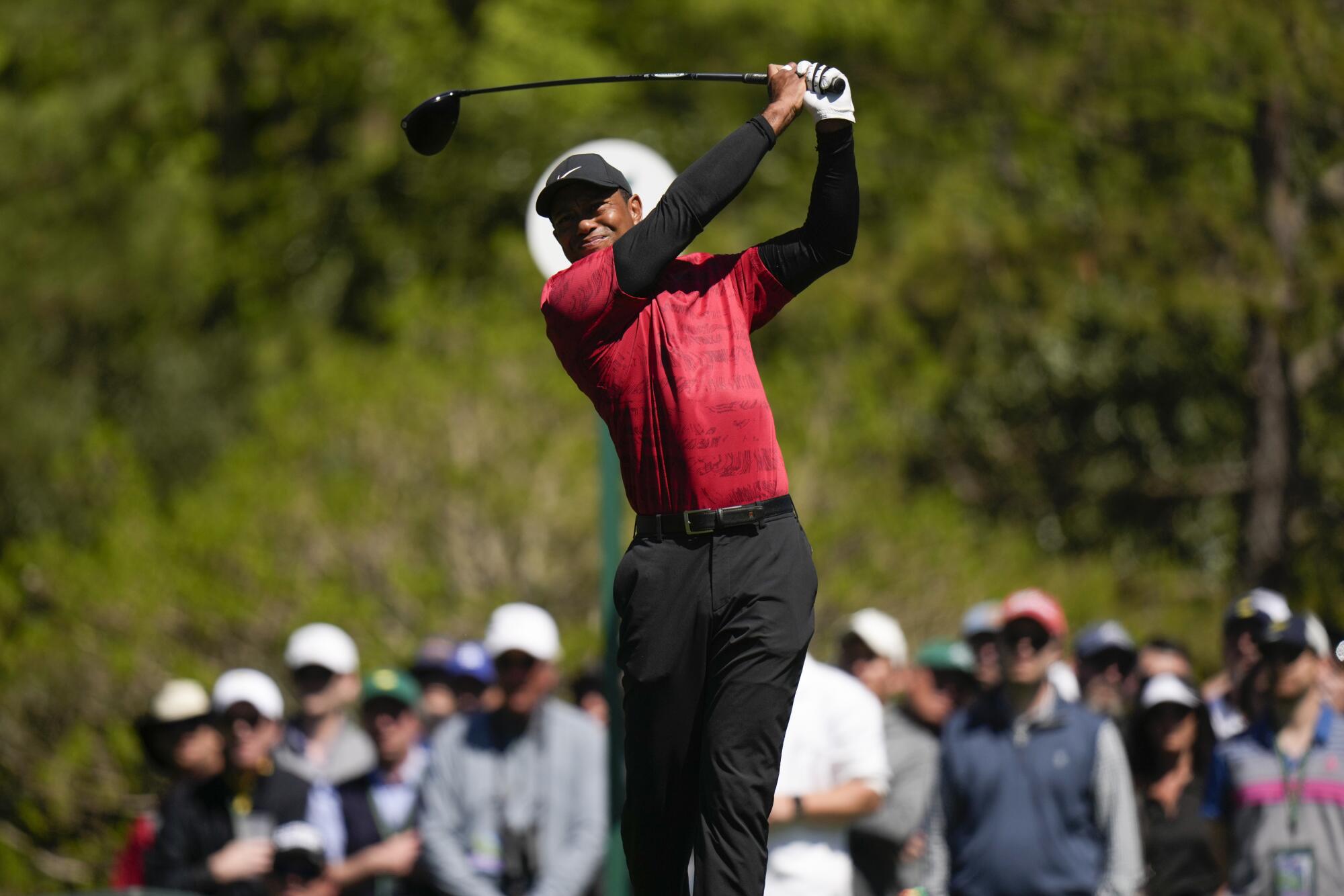 Tiger Woods tees off on the fifth hole during the final round.