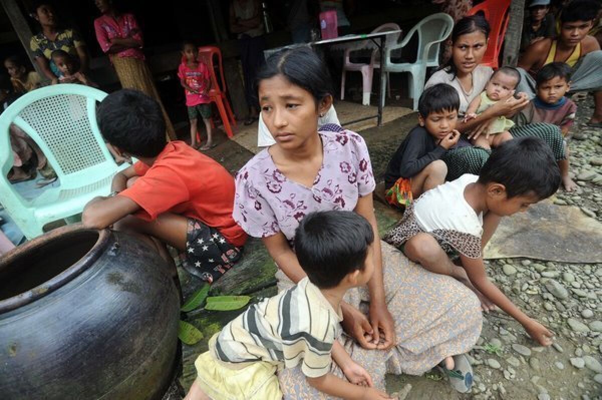 Muslim residents take shelter at a house in Thabyu Chai village near Thandwe in western Myanmar on Wednesday amid fresh anti-Muslim unrest.