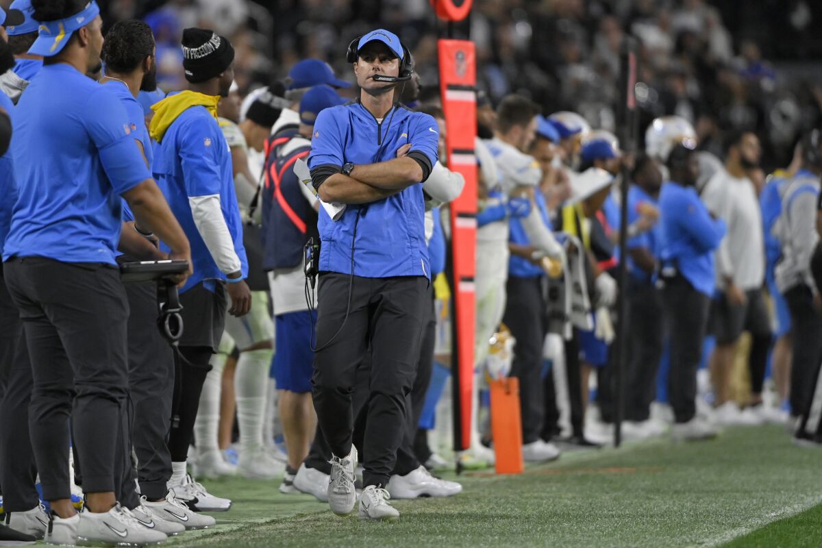 Los Angeles Chargers head coach Brandon Staley walks along the sideline during the second half of an NFL football game against the Las Vegas Raiders, Sunday, Jan. 9, 2022, in Las Vegas. (AP Photo/David Becker)