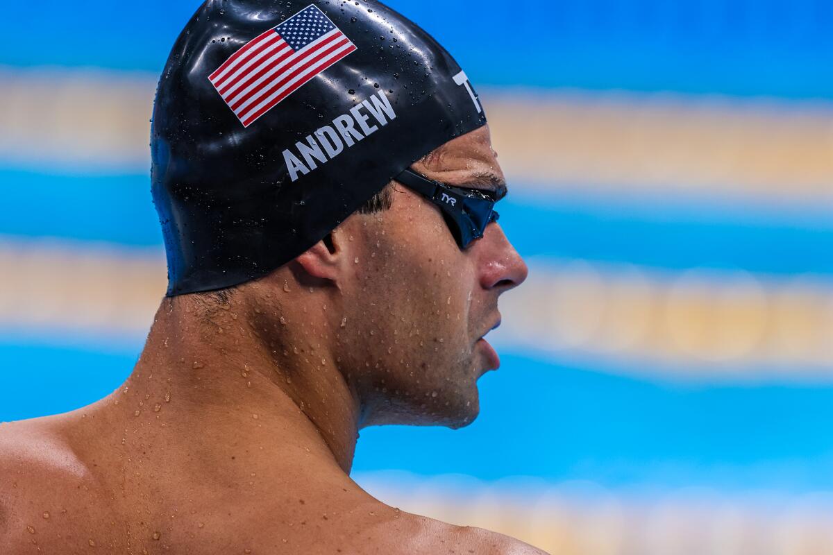 USA swimmer Michael Andrew warms up poolside before he competes.