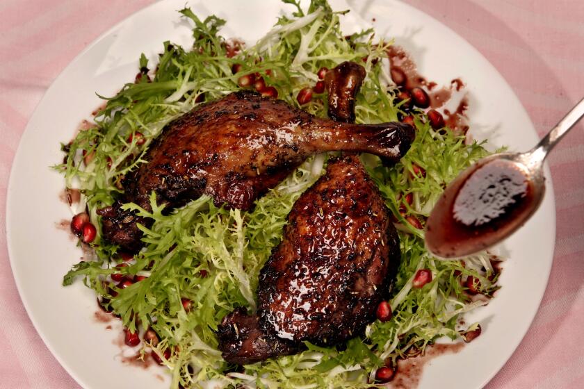 Pomegranate-braised duck legs