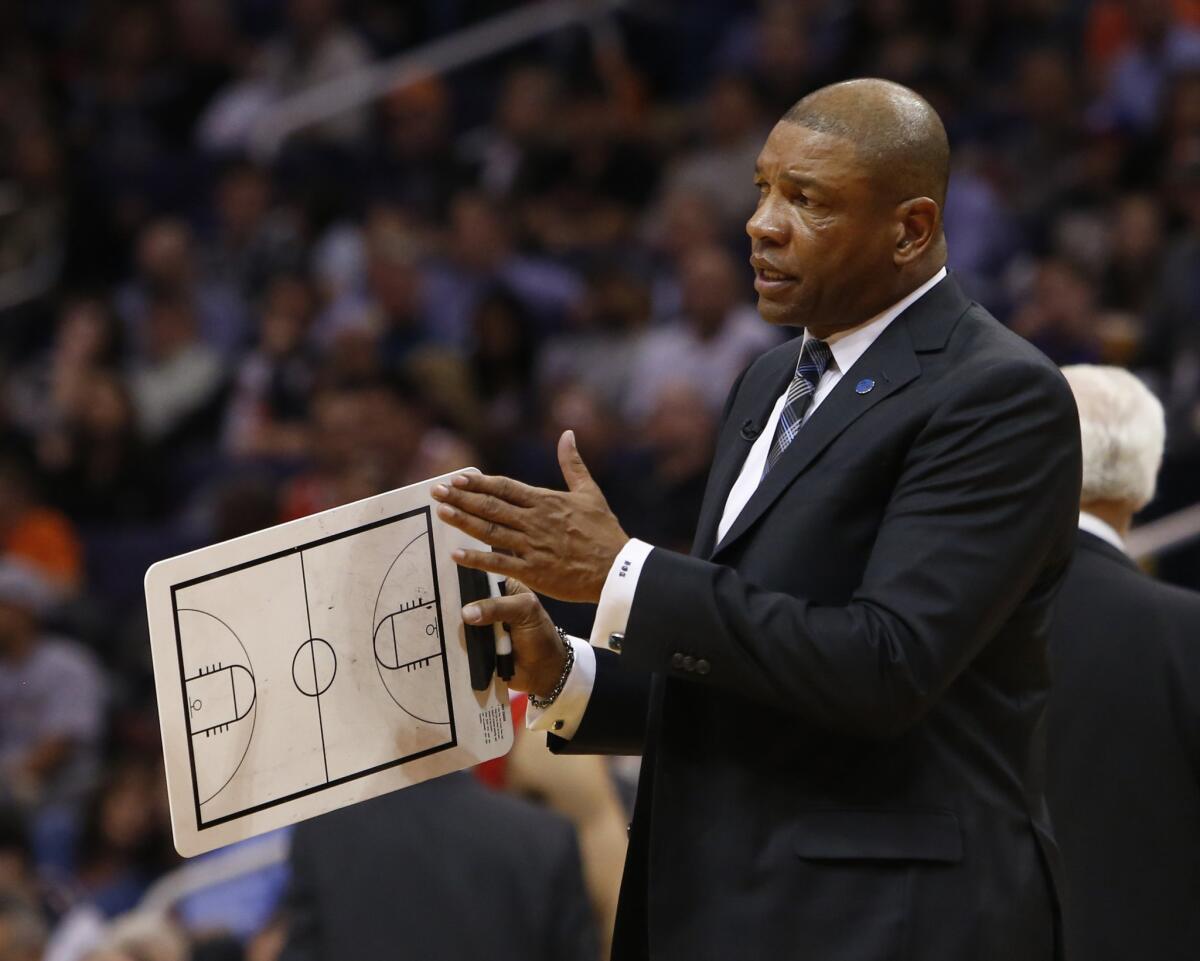 Clippers Coach Doc Rivers gets ready to diagram a play during a timeout Thursday night in Phoenix.