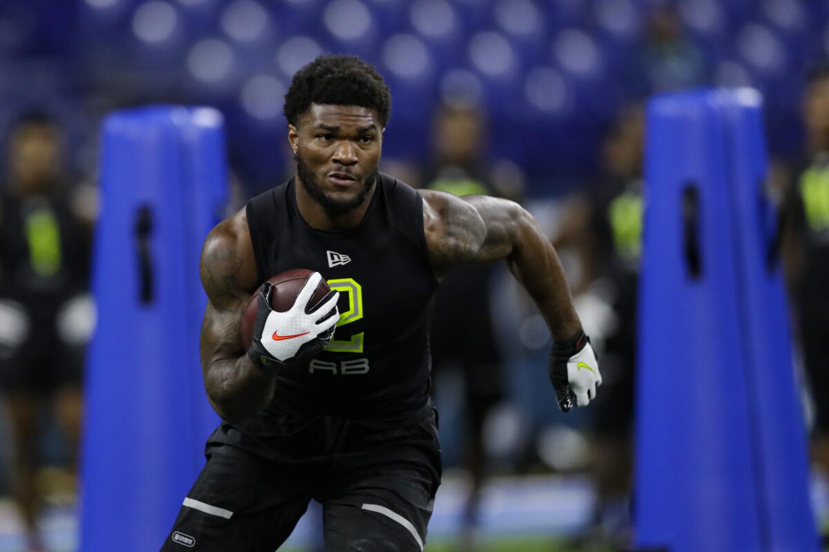 Florida State running back Cam Akers runs a drill at the NFL football scouting combine in Indianapolis.