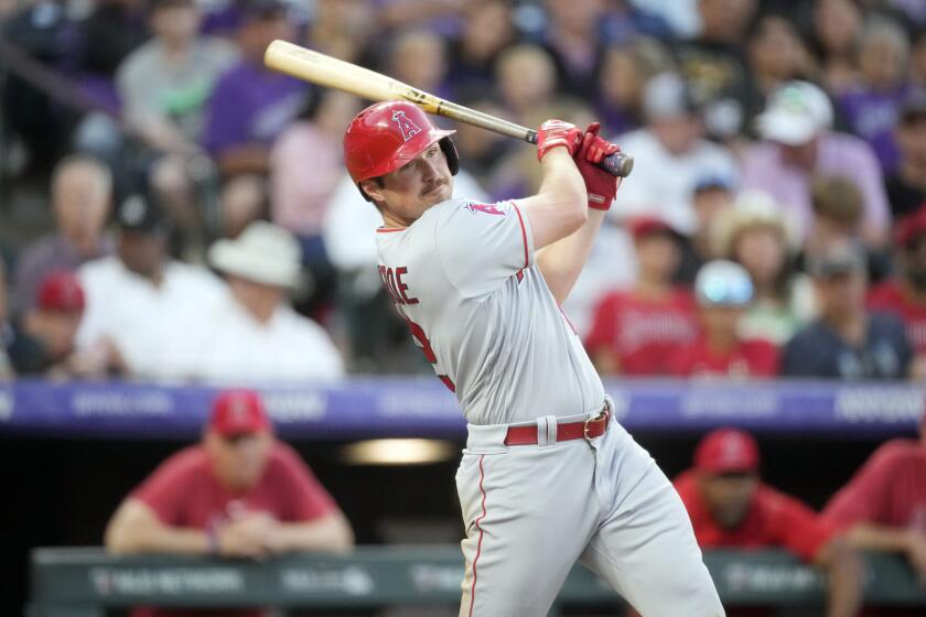 The Angels' Hunter Renfroe follows the flight of his double to drive in three runs 