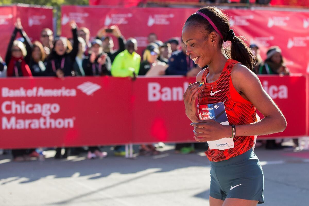 Rita Jeptoo reacts after crossing the finish line to win the Chicago Marathon on Oct. 21.