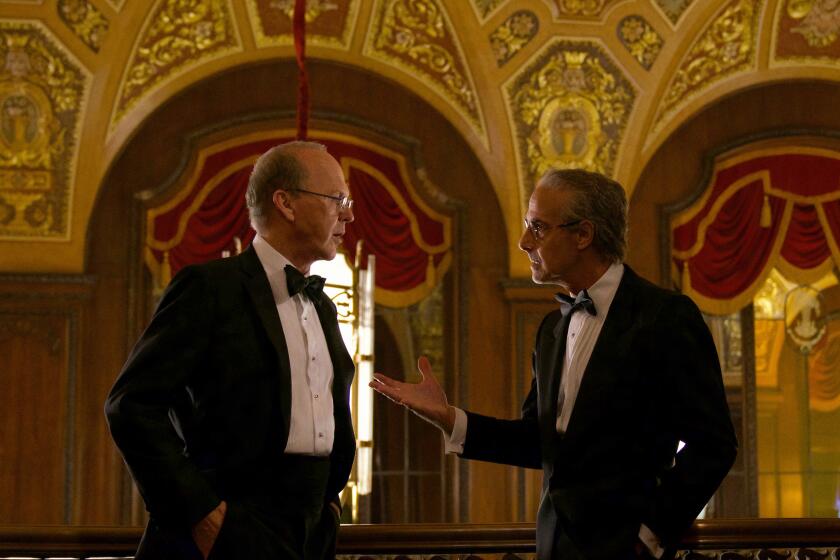 Michael Keaton, left, and Stanley Tucci  in the 2021 drama “Worth”