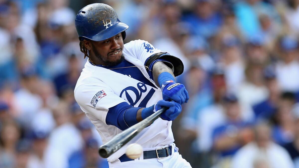 Dodgers shortstop Hanley Ramirez hits a run-scoring single during Game 1 of the National League division series against the St. Louis Cardinals on Oct. 3.