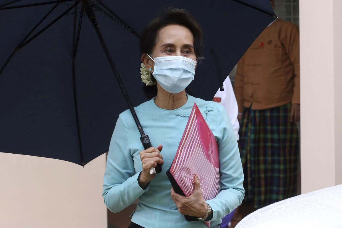 Myanmar leader Aung San Suu Kyi leaves after the Central Executive Committee meeting in Naypyitaw, Myanmar.