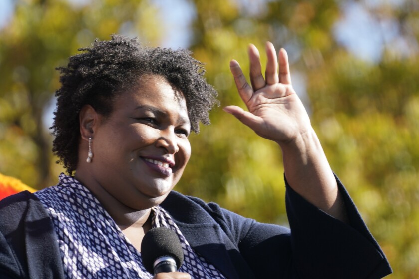FILE - In this Monday, Nov. 2, 2020, file photo, Stacey Abrams speaks to Biden supporters as they wait for former President Barack Obama to arrive and speak at a campaign rally for Biden at Turner Field in Atlanta. (AP Photo/Brynn Anderson, File)