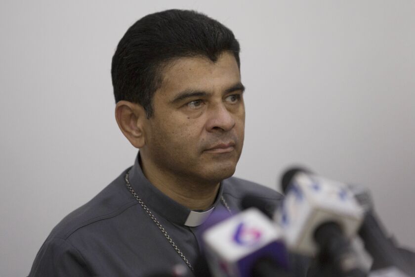 FILE - Monsignor Rolando Alvarez, bishop of Matagalpa, attends a press conference regarding the Roman Catholic Church's agreeing to act as "mediator and witness" in a national dialogue between members of civil society and the government in Managua, Nicaragua, May 3, 2018. Earlier this month Nicaragua shuttered seven radio stations belonging to the Catholic Church and launched an investigation into Alvarez, accusing him of inciting violent actors “to carry out acts of hate against the population.” (AP Photo/Moises Castillo, File)
