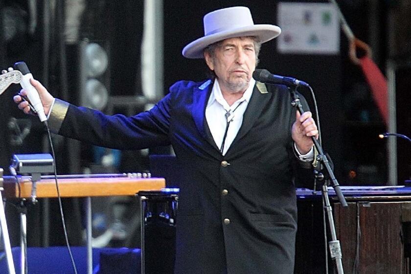 Bob Dylan, shown performing in France in 2012, will display his pastel paintings at London's National Portrait Gallery starting in late August.