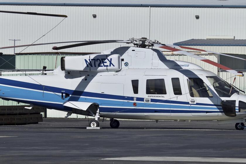 ADDS TO SAY THIS HELICOPTER WAS THE ACTUAL ONE THAT CRASHED SUNDAY, JAN. 26, 2020 - This Feb. 1, 2018, photo shows a Sikorsky S-76B helicopter (N72EX) at Van Nuys Airport in Van Nuys, Calif. NBA legend Kobe Bryant, his 13-year-old daughter and several others are dead after their helicopter, shown in this February 2018 photo, went down in Southern California. The chopper crashed Sunday, Jan. 26, 2020, in Calabasas, about 30 miles northwest of downtown Los Angeles. (AP Photo/Matt Hartman)
