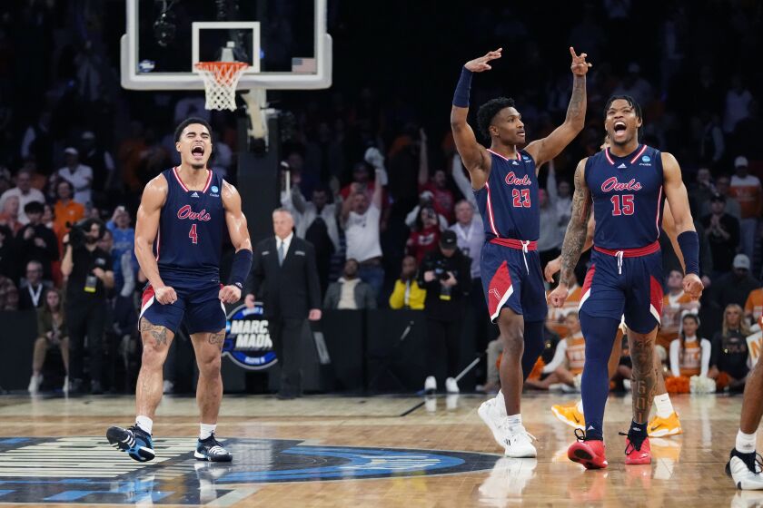 Florida Atlantic guards Bryan Greenlee (4), Brandon Weatherspoon (23) and Alijah Martin (15) react after the team defeated Tennessee 62-55 in a Sweet 16 college basketball game in the East Regional of the NCAA tournament at Madison Square Garden, Thursday, March 23, 2023, in New York. (AP Photo/Frank Franklin II)