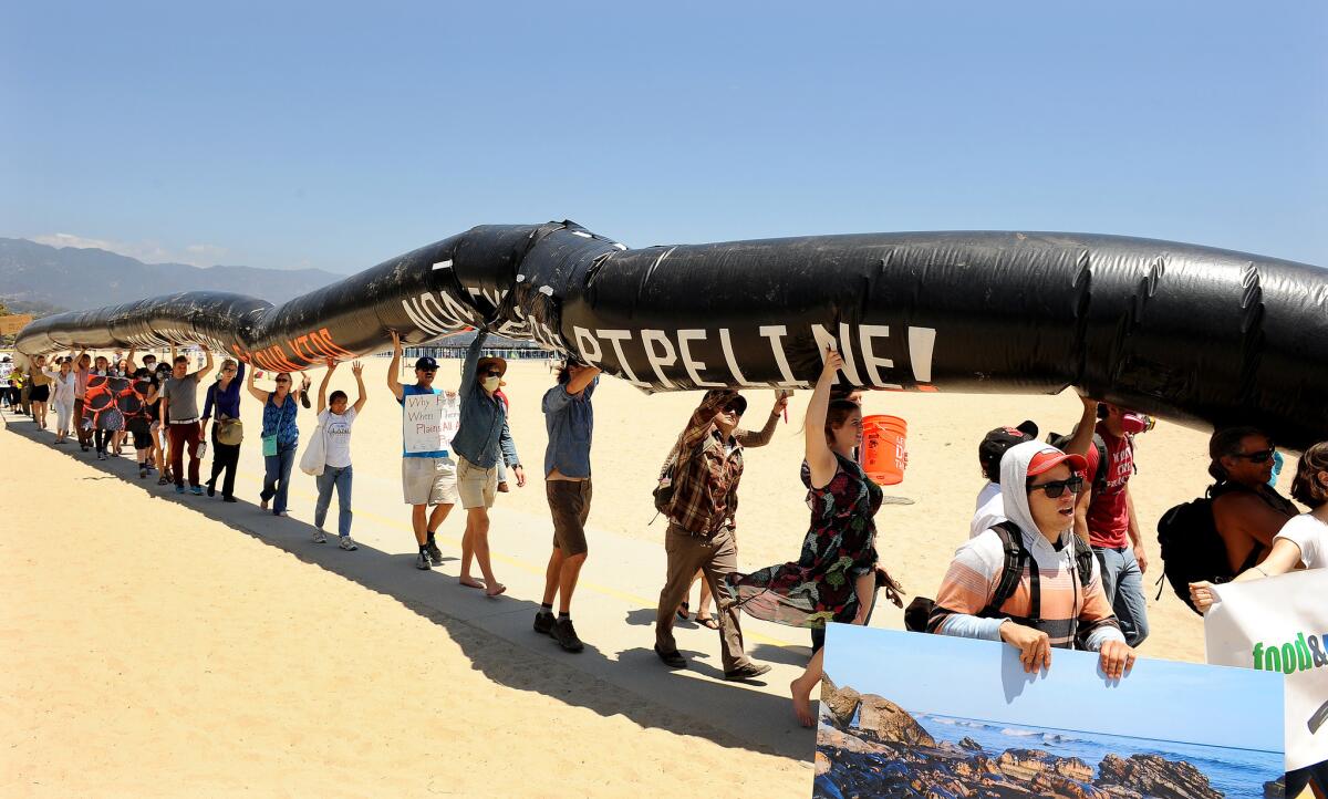 Concerned residents gather for a rally at the beach just south of the Santa Barbara oil spill site to call on Gov. Jerry Brown to ban fracking and other unconventional oil extraction methods that put California communities, the environment and natural resources at risk.
