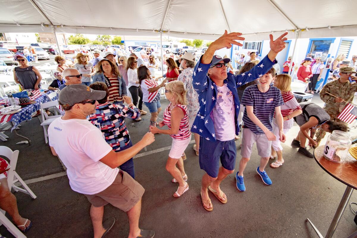 Happy yacht club guests dance to the music of M Street band.